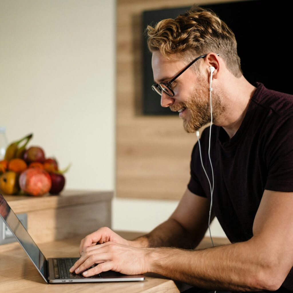 Young man working remotely and heaving a meeting