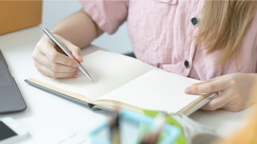 woman writing in her planner